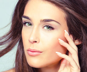 A young woman with smooth, soft skin.