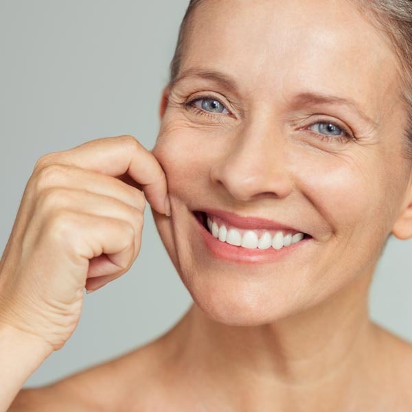 Woman touching face